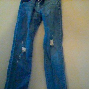 blue back covered ripped open bottom jeans